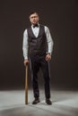 handsome stylish man standing with baseball bat