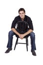 Handsome and stylish model sitting on chair