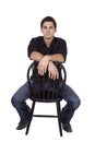 Handsome and stylish model sitting on chair