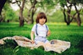 Handsome stylish 3 years old toddler child boy with funny face in suspenders enjoying sweets on picnic Royalty Free Stock Photo