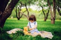 Handsome stylish 3 years old toddler child boy with funny face in suspenders enjoying sweets on picnic Royalty Free Stock Photo