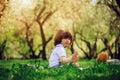 Handsome stylish 3 years old toddler child boy with funny face in suspenders enjoying sweets on picnic in spring Royalty Free Stock Photo