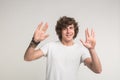 Handsome stylish young man having fun on white background