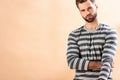 Handsome stylish young man posing in striped sweatshirt Royalty Free Stock Photo