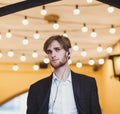 Handsome in a suit with headphones