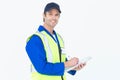 Handsome supervisor writing notes on clipboard Royalty Free Stock Photo