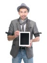 Handsome surprised man in hat with digital tablet pc.