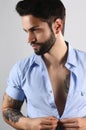 Handsome tattooed man posing