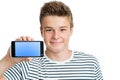 Handsome teen showing smart phone with blank screen.
