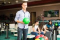 Boy Enjoying Bowling At Alley In Club Royalty Free Stock Photo