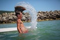 Handsome teenage boy swimming on a swim board Royalty Free Stock Photo