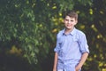 Handsome Teenager Boy Poses Outdoors, Exuding Confidence and Style in a Captivating Portrait. Happy Preteen Child.