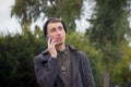 Handsome teenager talking on a mobile phone. Royalty Free Stock Photo