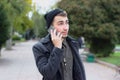 Handsome teenager talking on a mobile phone. Royalty Free Stock Photo