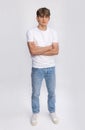 Handsome teenager teen male boy teen young adult wearing white t-shirt and jeans Royalty Free Stock Photo