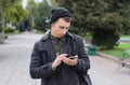 Handsome teenager texting on a mobile phone Royalty Free Stock Photo