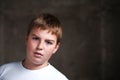 Handsome teenaiger looking self assured at camera Royalty Free Stock Photo