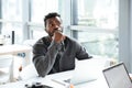 Handsome thinking serious young man sitting in office coworking Royalty Free Stock Photo