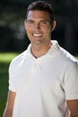 Handsome Thirties Man In White Polo Shirt Royalty Free Stock Photo
