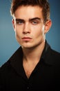 Handsome trendy young man in black shirt, portrait of fashi