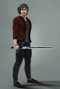 Handsome Urban Fantasy Male Enforcer Holding a Sword Royalty Free Stock Photo