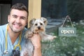 Handsome veterinarian holding Yorkshire Terrier Royalty Free Stock Photo