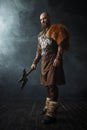 Handsome viking with axe, nordic barbarian image