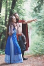 Handsome Warrior Viking man with beautiful medieval woman outdoor