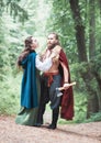 Handsome Warrior Viking man with beautiful medieval woman standing