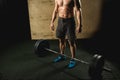 Handsome weightlifter preparing for training with barbell Royalty Free Stock Photo