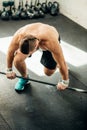 Handsome weightlifter preparing for training with barbell Royalty Free Stock Photo