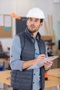 handsome worker looking at hanged carrot - motivation concept Royalty Free Stock Photo