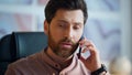 Handsome worker making call sitting workplace closeup. Manager talking telephone Royalty Free Stock Photo