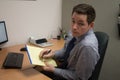 Handsome Young Accountant Working at Office Royalty Free Stock Photo