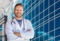 Handsome Young Adult Male Doctor With Beard In Front of Hospital Royalty Free Stock Photo