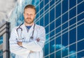 Handsome Young Adult Male Doctor With Beard In Front of Hospital Royalty Free Stock Photo