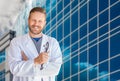 Handsome Young Adult Male Doctor With Beard In Front of Hospital Royalty Free Stock Photo