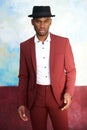 Handsome young african american male fashion model posing with vintage suit and hat Royalty Free Stock Photo