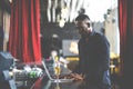 Handsome young African American man looking at laptop computer screen. Black businessman working on laptop computer at the club Royalty Free Stock Photo