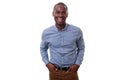 Handsome young african american man smiling by white background