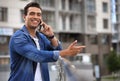 Handsome young African-American man talking on mobile phone. Space for text Royalty Free Stock Photo