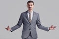 Handsome young arabic businessman with mustache in fashion gray suit Royalty Free Stock Photo