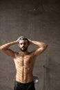 Handsome young Arabic male model taking hot shower Royalty Free Stock Photo