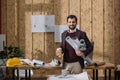 handsome young architect with coffee to go and rolled blueprints Royalty Free Stock Photo