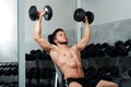 Handsome young athlete working out at the gym Royalty Free Stock Photo