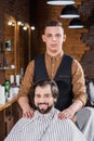 handsome young barber standing behind client Royalty Free Stock Photo