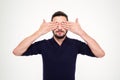 Handsome young bearded man closed eyes with hands Royalty Free Stock Photo