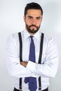 Handsome young bearded man in formal wear with crossed arms. Royalty Free Stock Photo