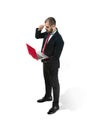 Picture of handsome young bearded man standing over white studio background with laptop Royalty Free Stock Photo