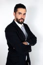 Handsome young bearded man in suit with crossed arms Royalty Free Stock Photo